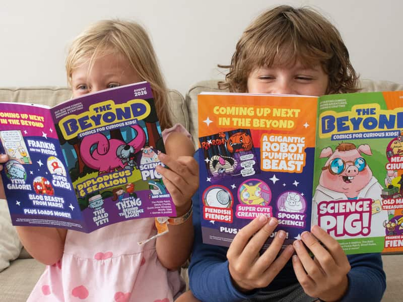 Image of 2 children reading copies of The Beyond Comic