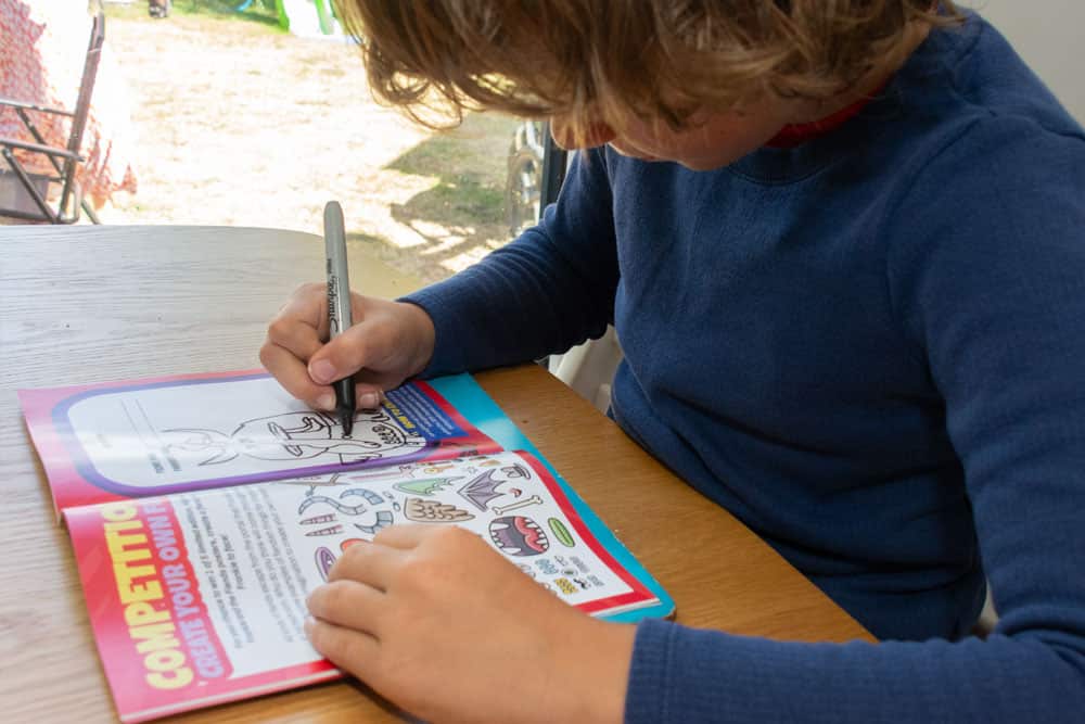 Image of a child drawing in a competition page in an issue of The Beyond Comic